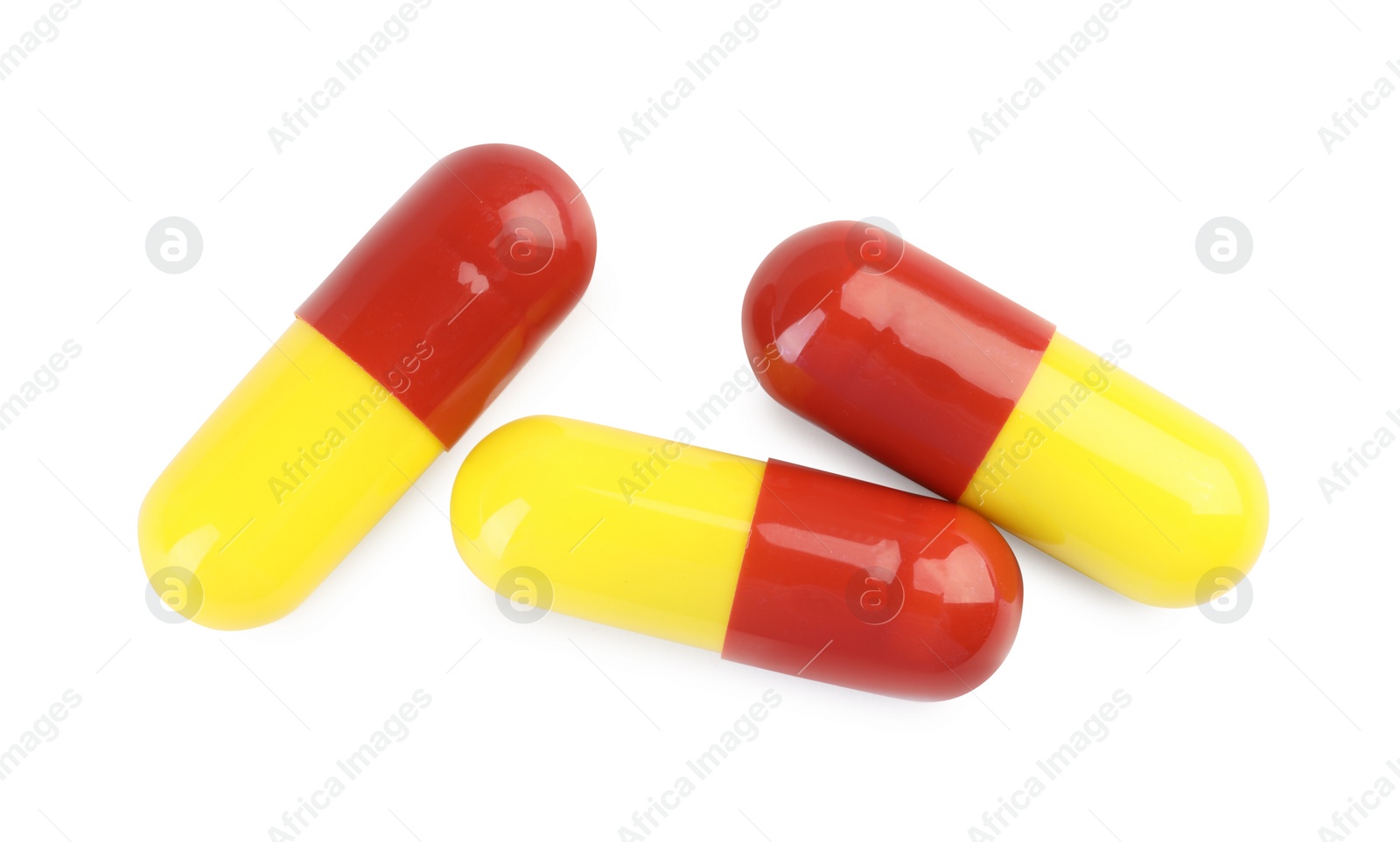 Photo of Three antibiotic pills isolated on white, top view