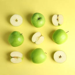 Photo of Flat lay composition of fresh ripe green apples on yellow background