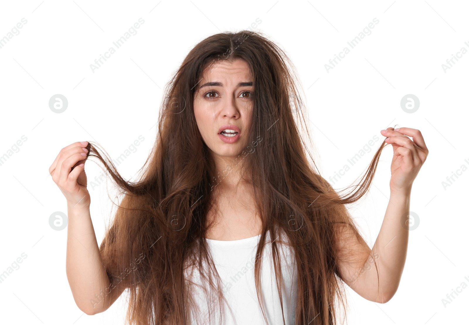 Photo of Emotional woman with tangled hair on white background