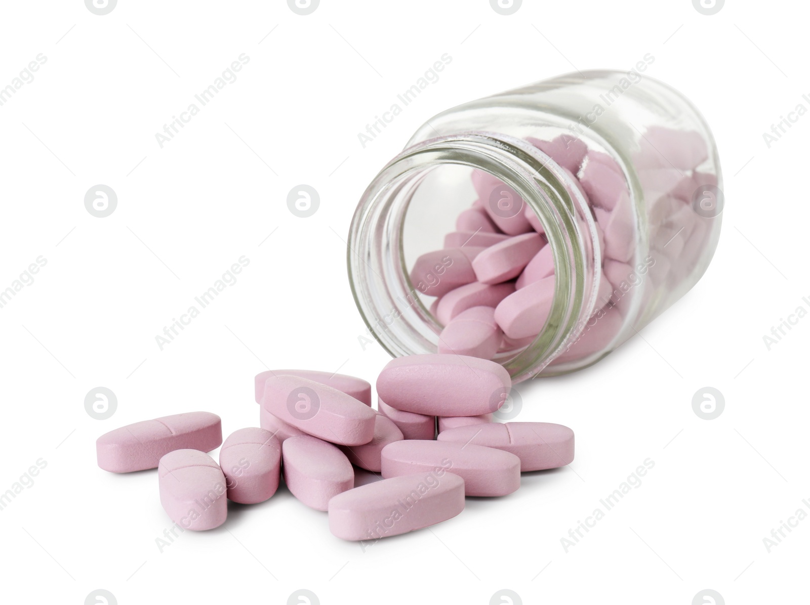 Photo of Scattered vitamin pills and bottle isolated on white