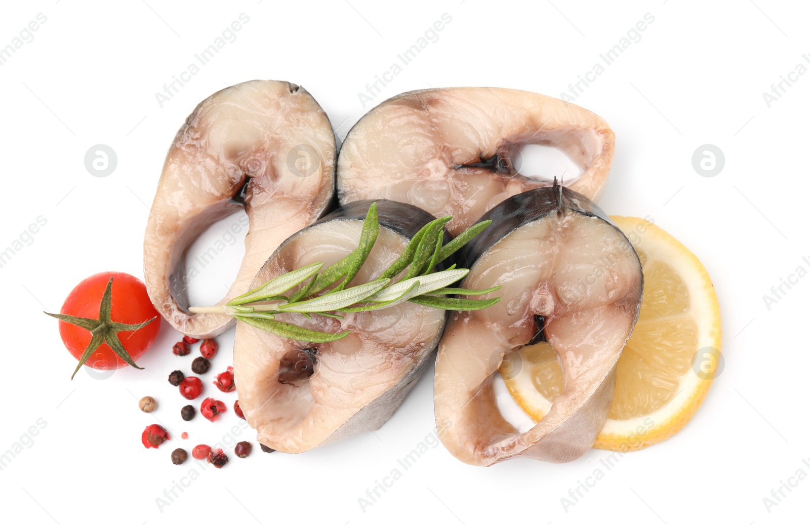Photo of Pieces of mackerel fish with cherry tomato, rosemary, lemon and spices on white background, top view