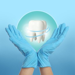 Dentist demonstrating virtual model of healthy tooth on light blue background, closeup