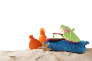 Photo of Composition with beach objects on sand against white background