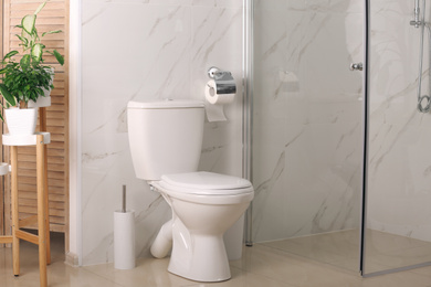 Photo of Stylish toilet bowl in modern bathroom interior
