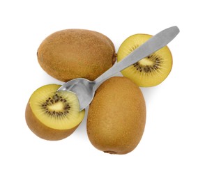 Photo of Fresh ripe yellow kiwis with spoon on white background, top view