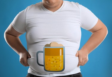 Image of Beer belly problem. Overweight man on blue background, closeup