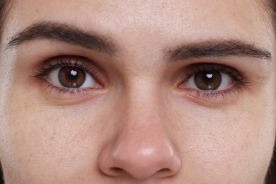 Photo of Closeup view of woman with beautiful hazel eyes