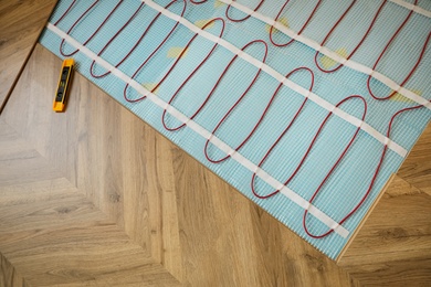 Photo of Installation of electric underfloor heating system indoors, above view
