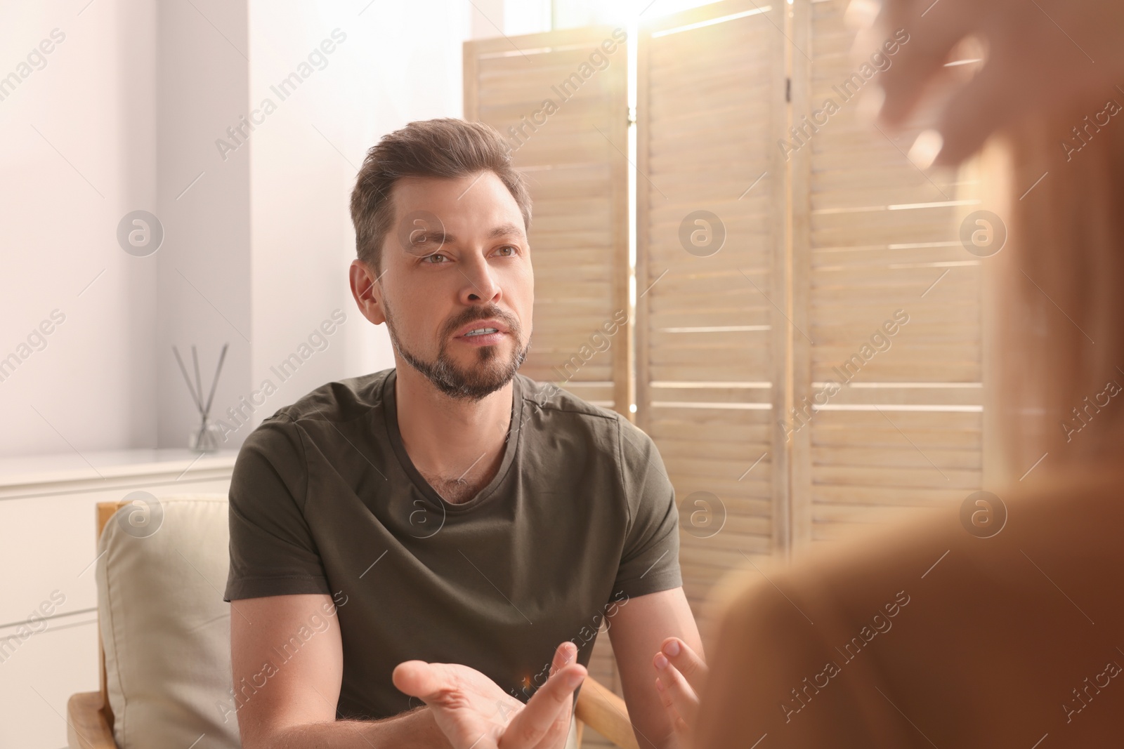 Photo of Psychologist working with military officer in office