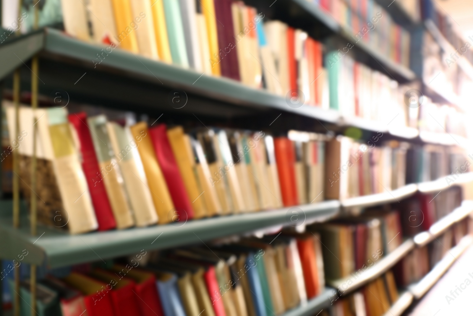 Photo of Blurred view of books on shelves in library