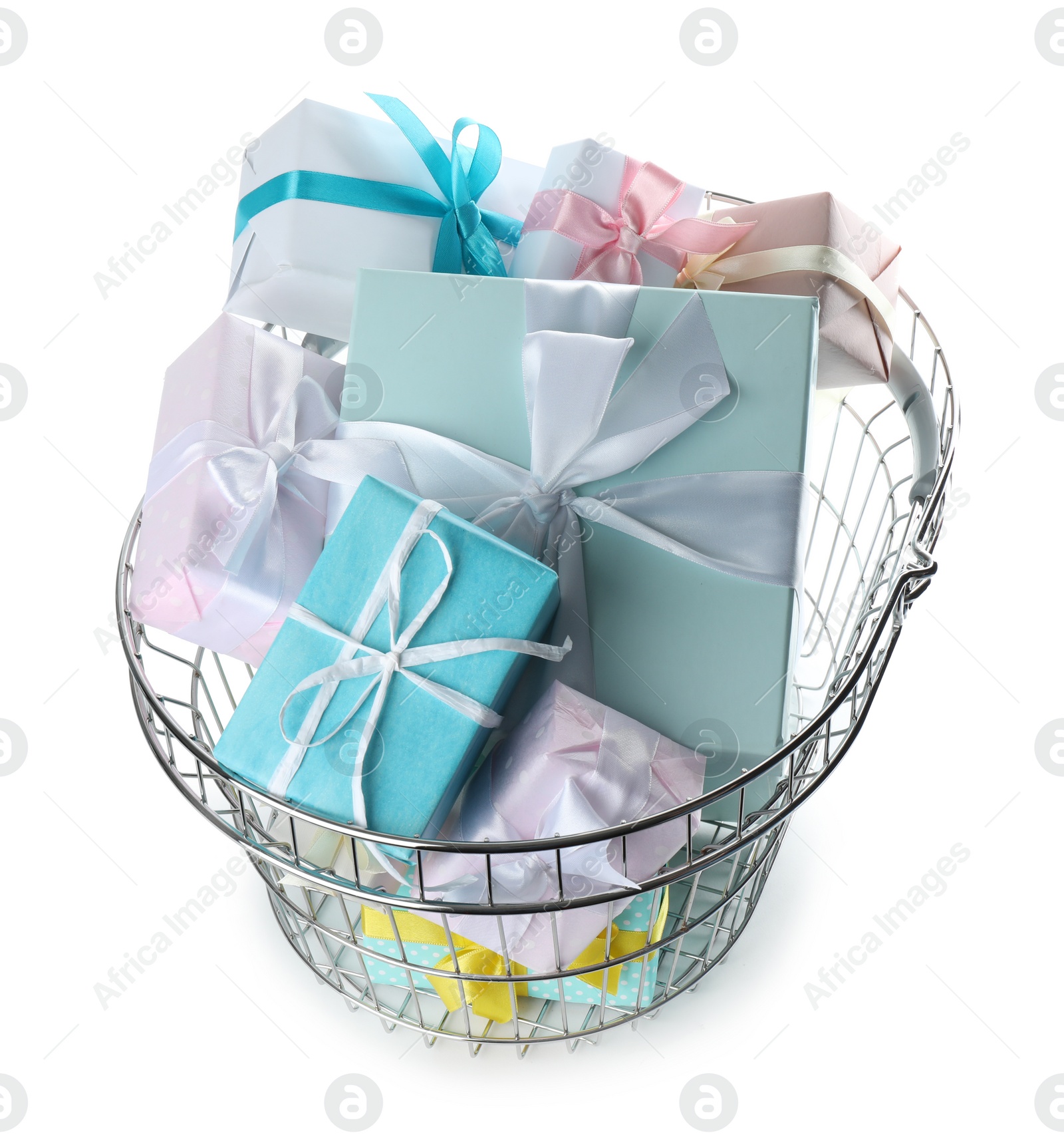 Photo of Shopping basket full of gift boxes on white background