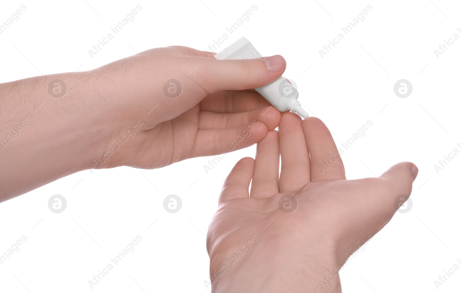 Photo of Man applying ointment from tube onto his hand on white background, closeup