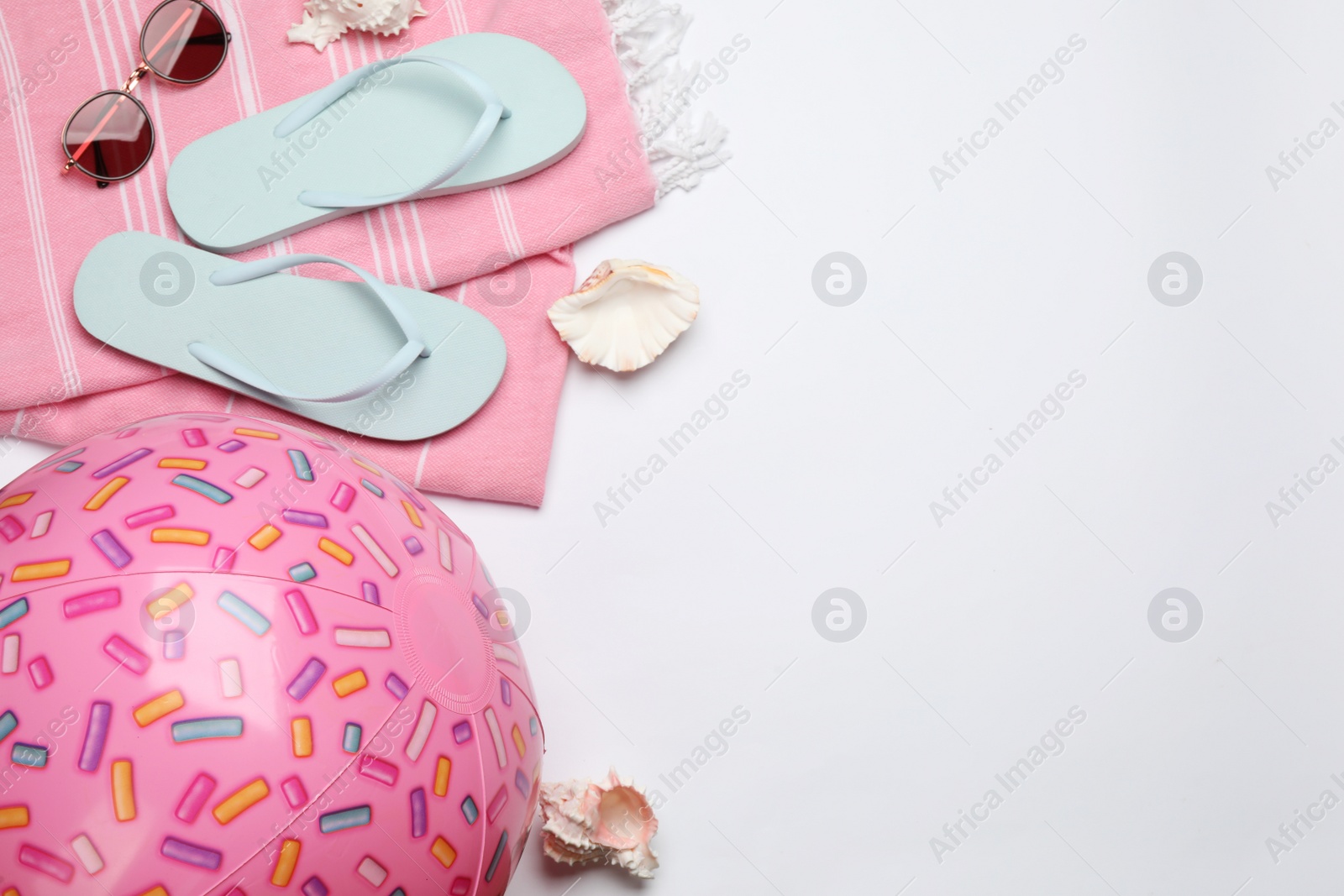 Photo of Flat lay composition with beach ball on white background