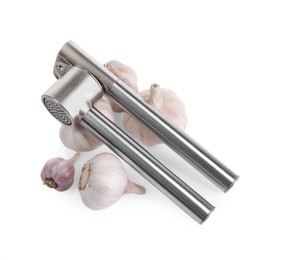 Photo of One metal press and garlic bulbs isolated on white, above view