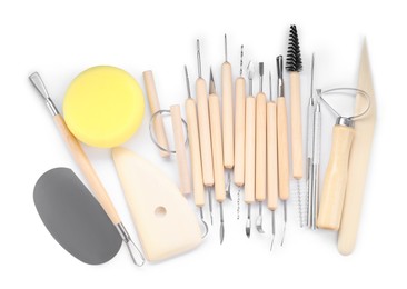 Photo of Set of different clay crafting tools isolated on white, top view