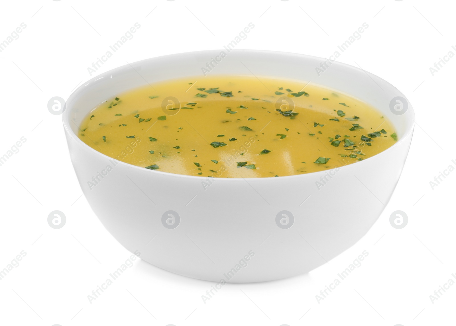 Photo of Bowl with lemon sauce on white background. Delicious salad dressing