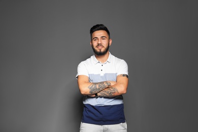 Portrait of handsome young man on gray background