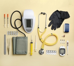 Photo of Flat lay composition with medical objects on color background