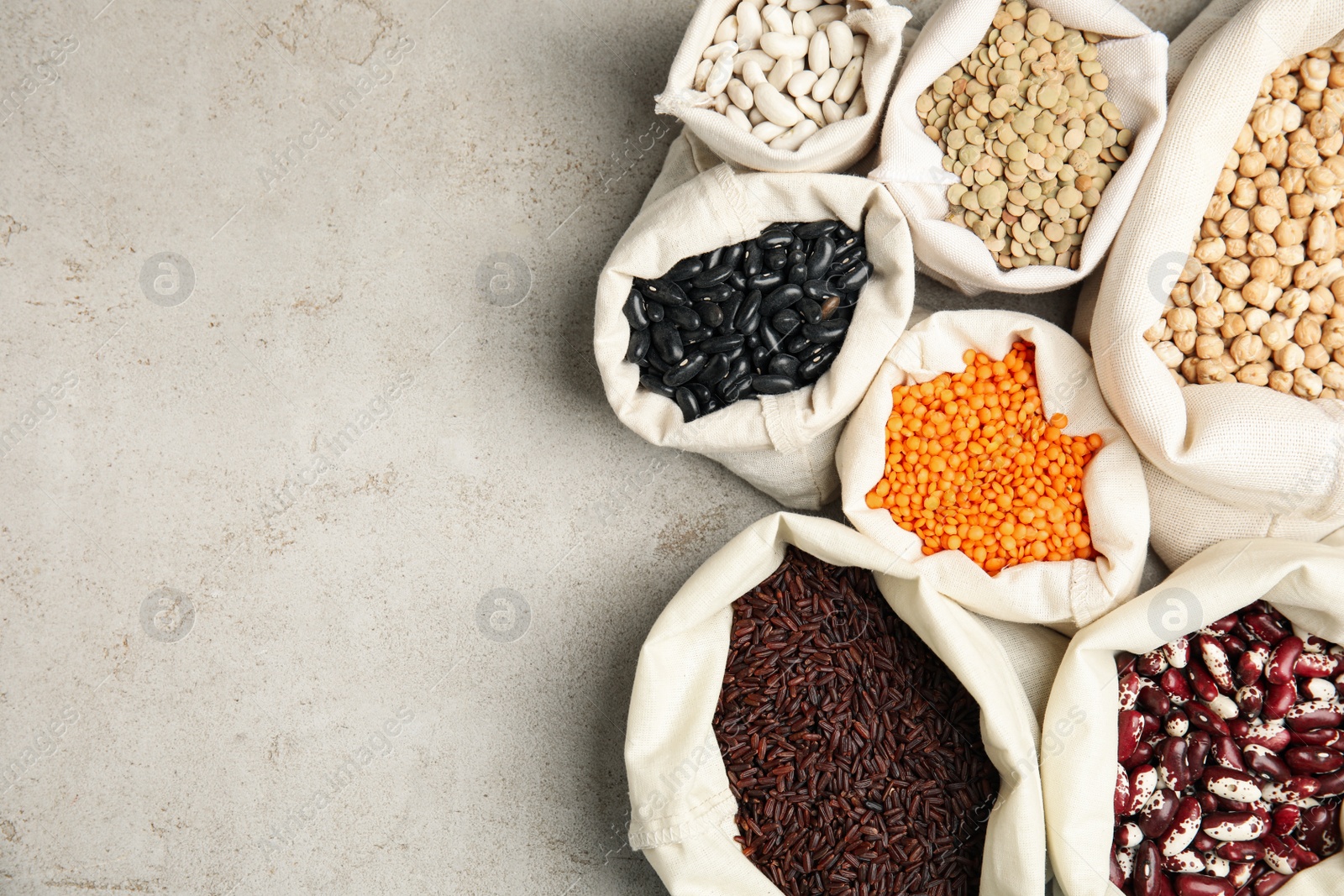 Photo of Different grains, seeds and space for text on white table, flat lay. Veggie diet