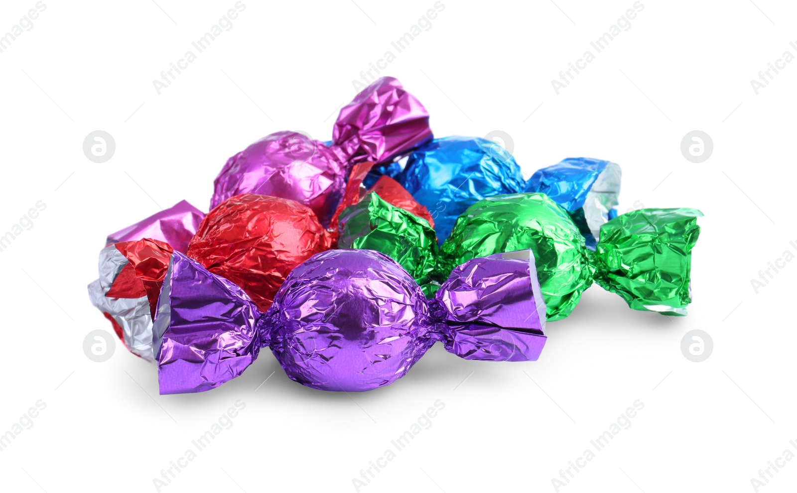 Photo of Tasty candies in colorful wrappers isolated on white