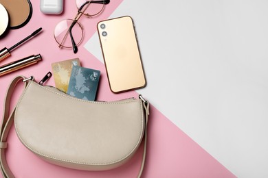 Photo of Flat lay composition with stylish woman's bag on color background. Space for text