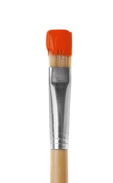 Photo of Brush with orange paint on white background