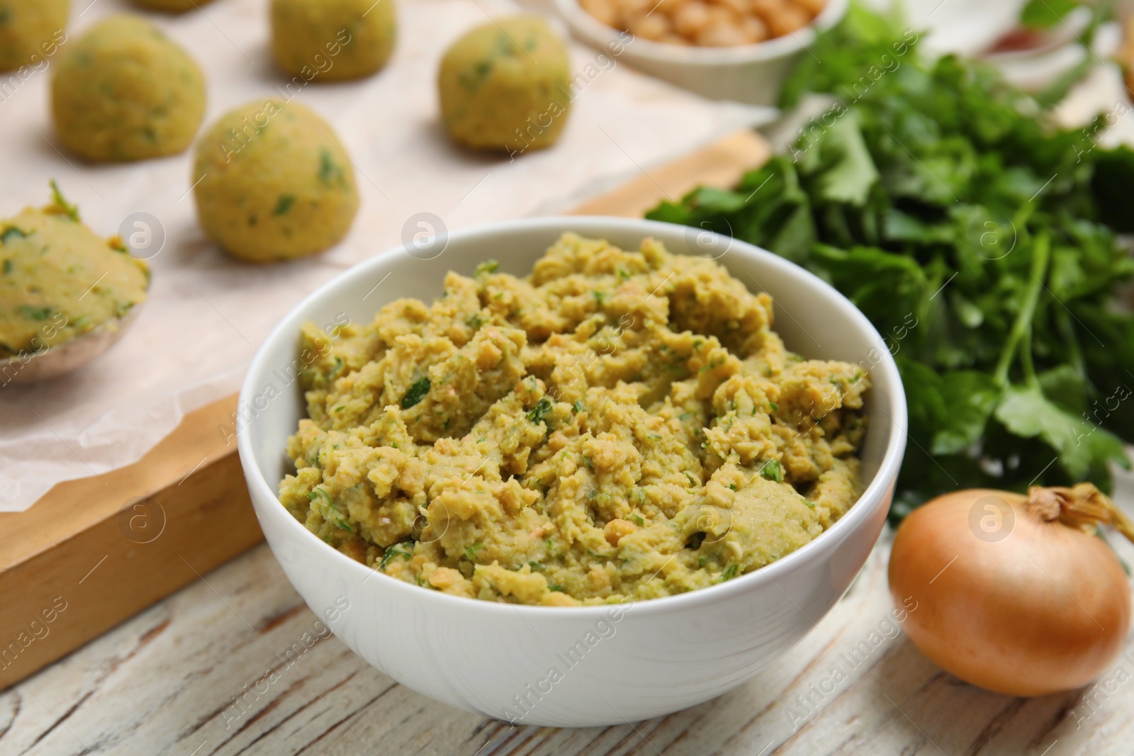 Photo of Ingredients for falafel on white wooden table