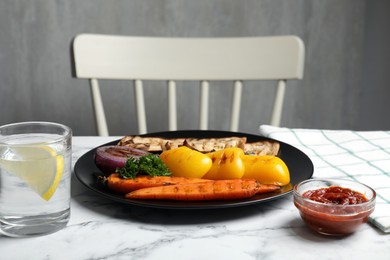 Photo of Delicious grilled vegetables served on white marble table