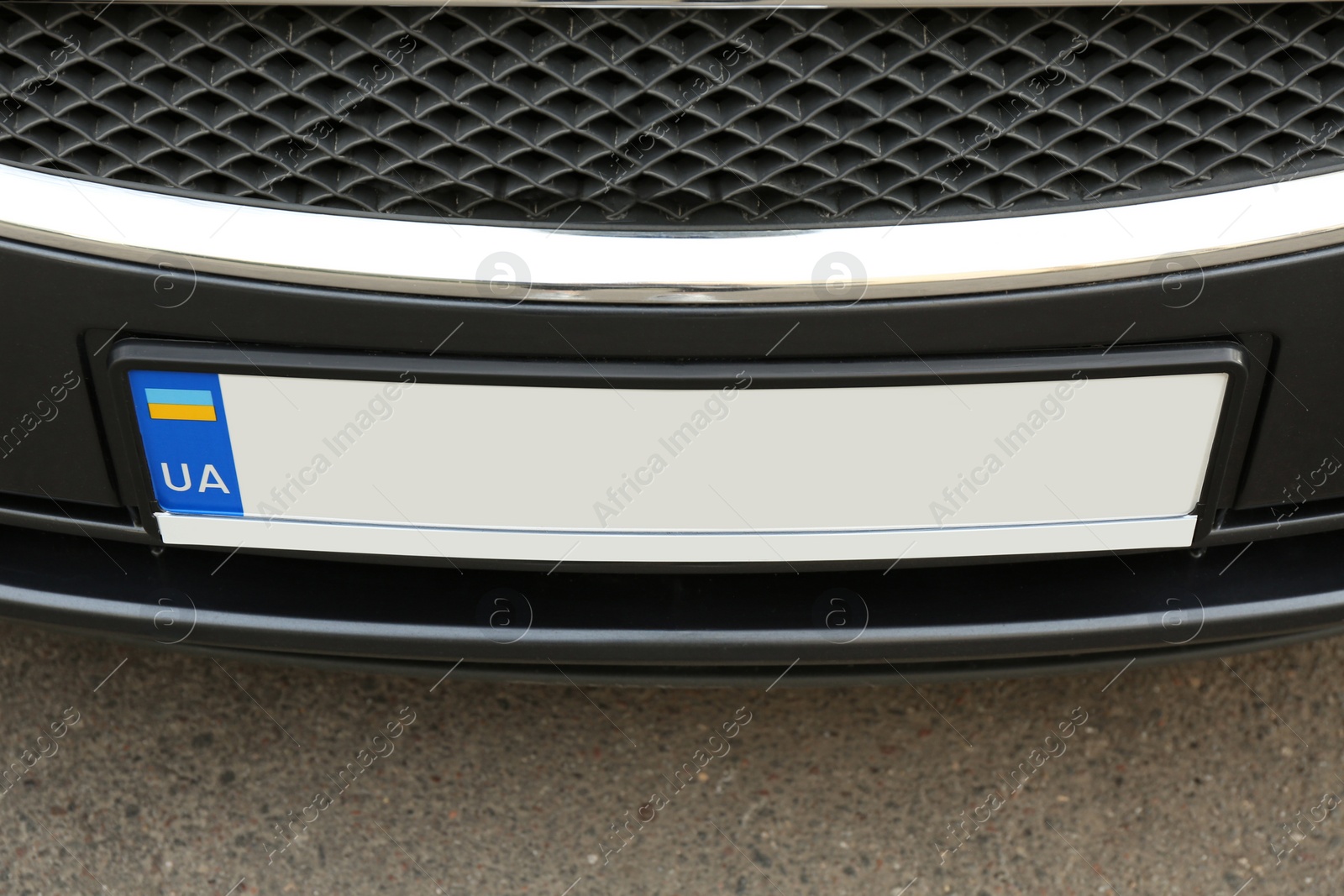 Photo of Car with vehicle registration plate outdoors, closeup