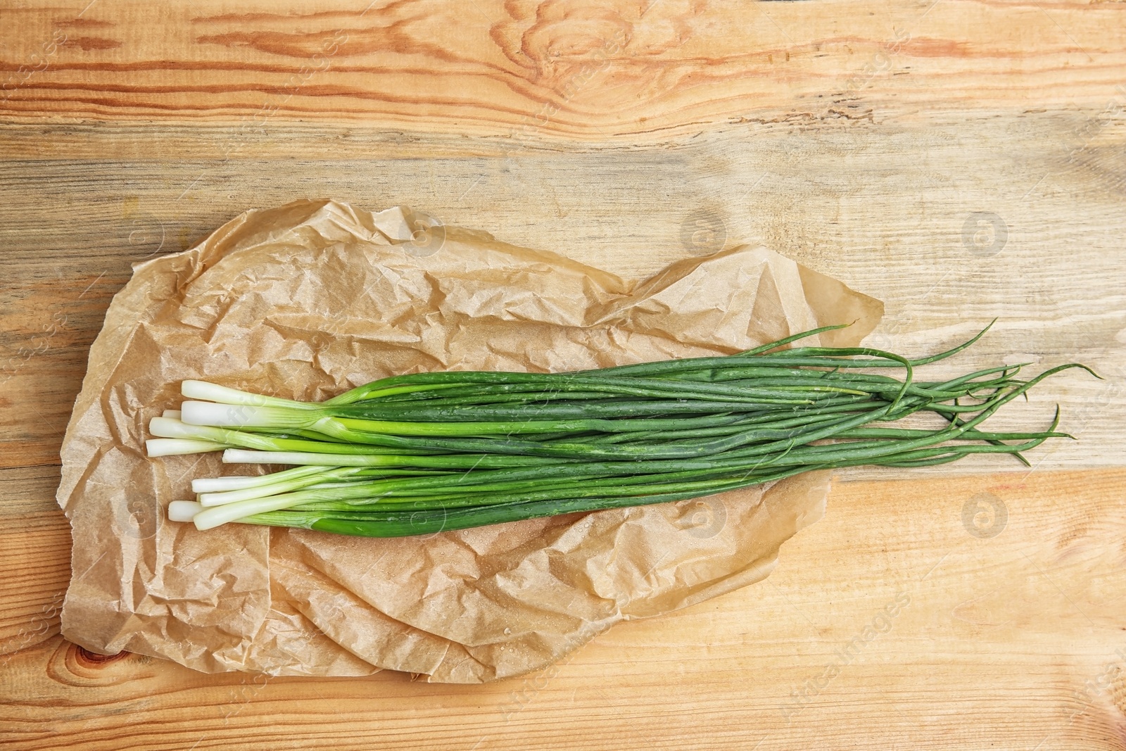 Photo of Fresh green onion on table, top view