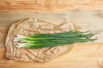 Fresh green onion on table, top view