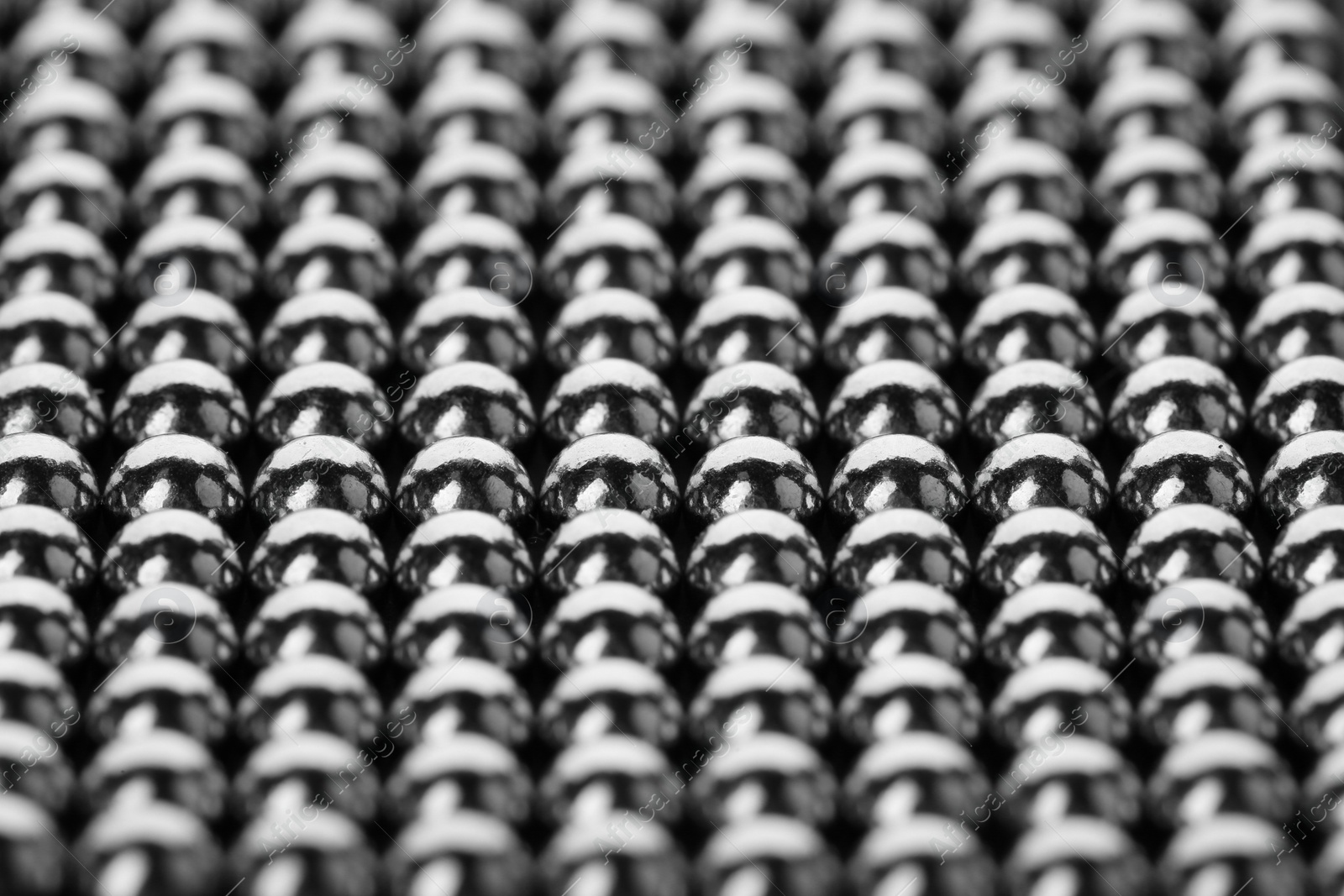 Photo of Small metal magnetic balls as background, closeup