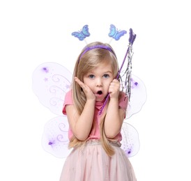 Photo of Surprised little girl in fairy costume with violet wings and magic wand on white background