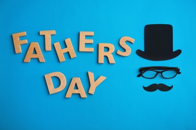 Photo of Flat lay composition with paper decor and glasses on color background. Happy Father's Day