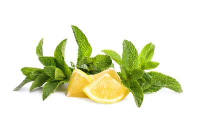 Fresh mint leaves and citrus fruit on white background