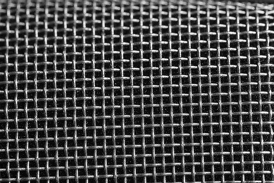 Metal mesh of microphone as background, closeup. Musical equipment