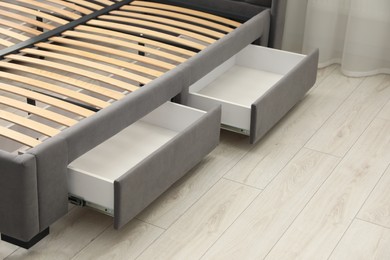 Photo of Storage drawers for bedding under modern bed in room