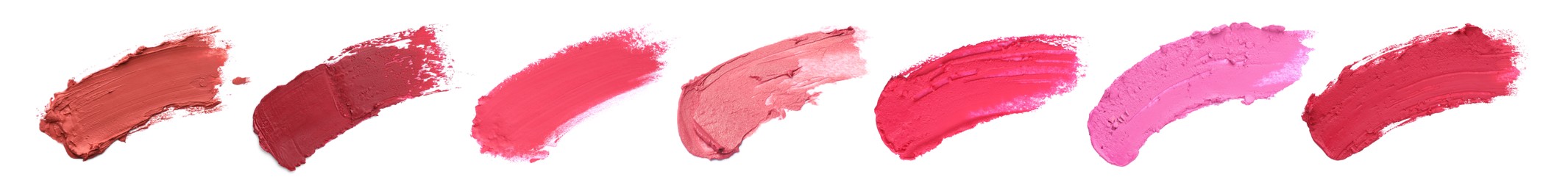 Image of Smears of different beautiful lipsticks on white background, top view. Banner design