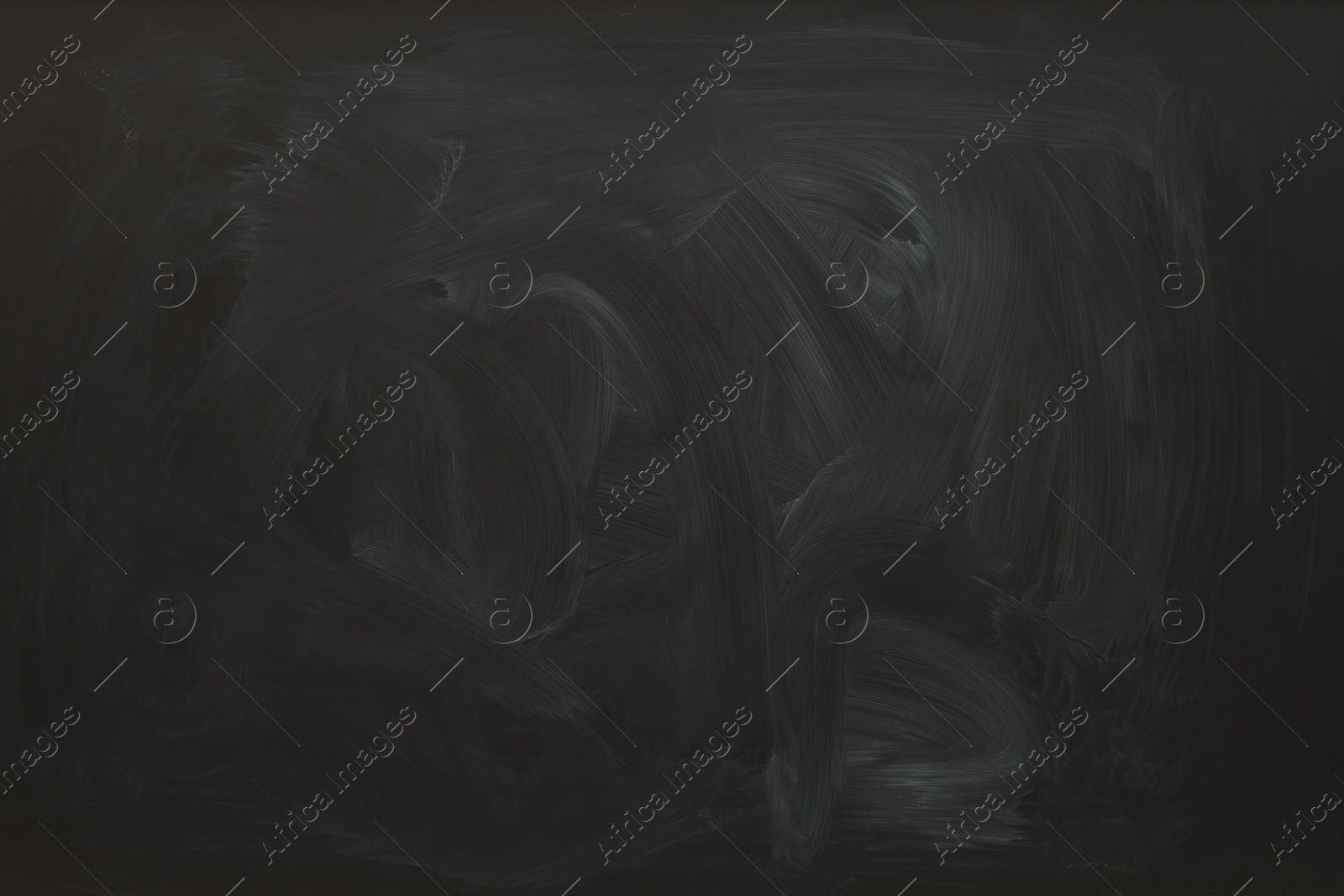 Photo of Dirty black chalkboard as background. School equipment