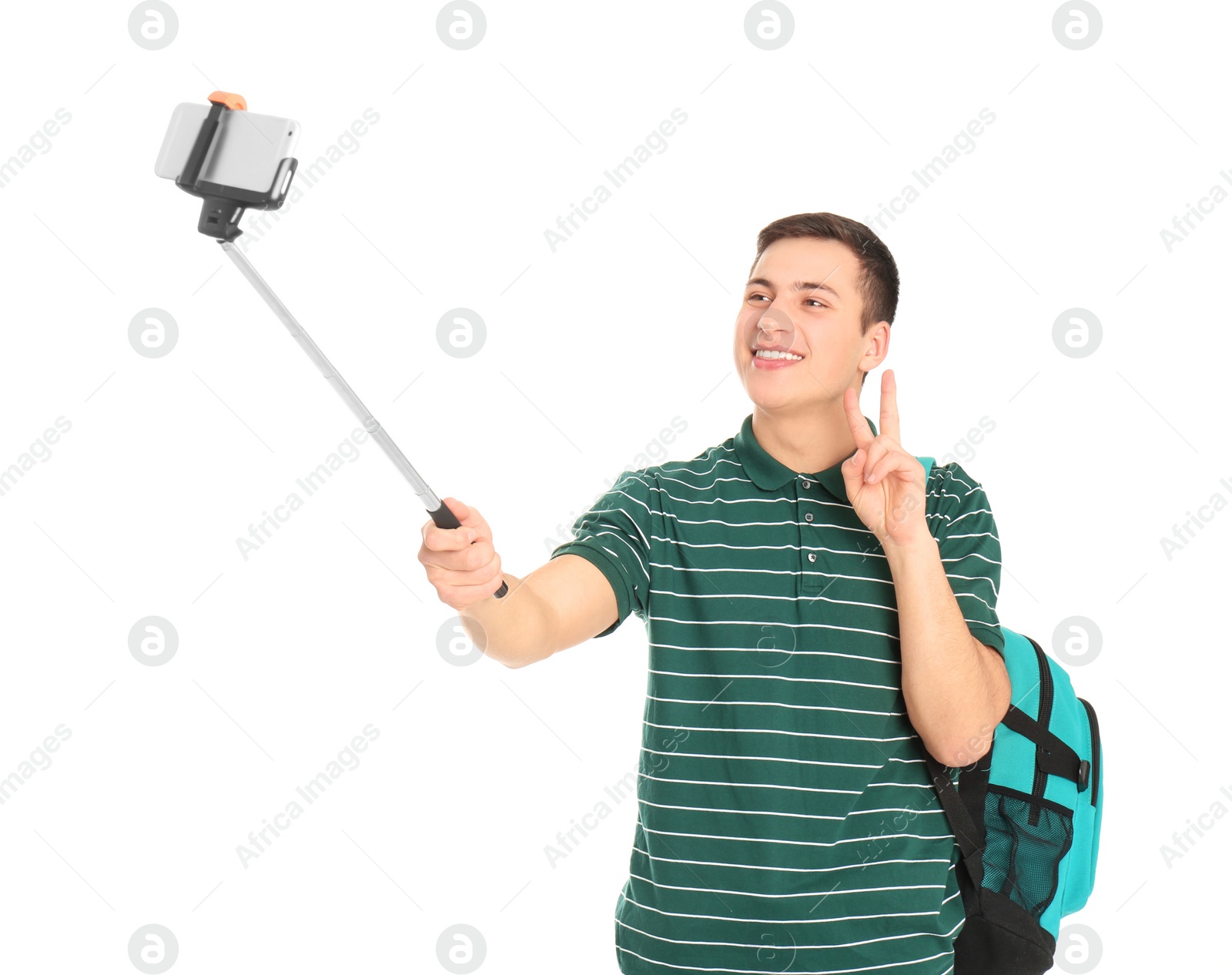 Photo of Young handsome man taking selfie against white background