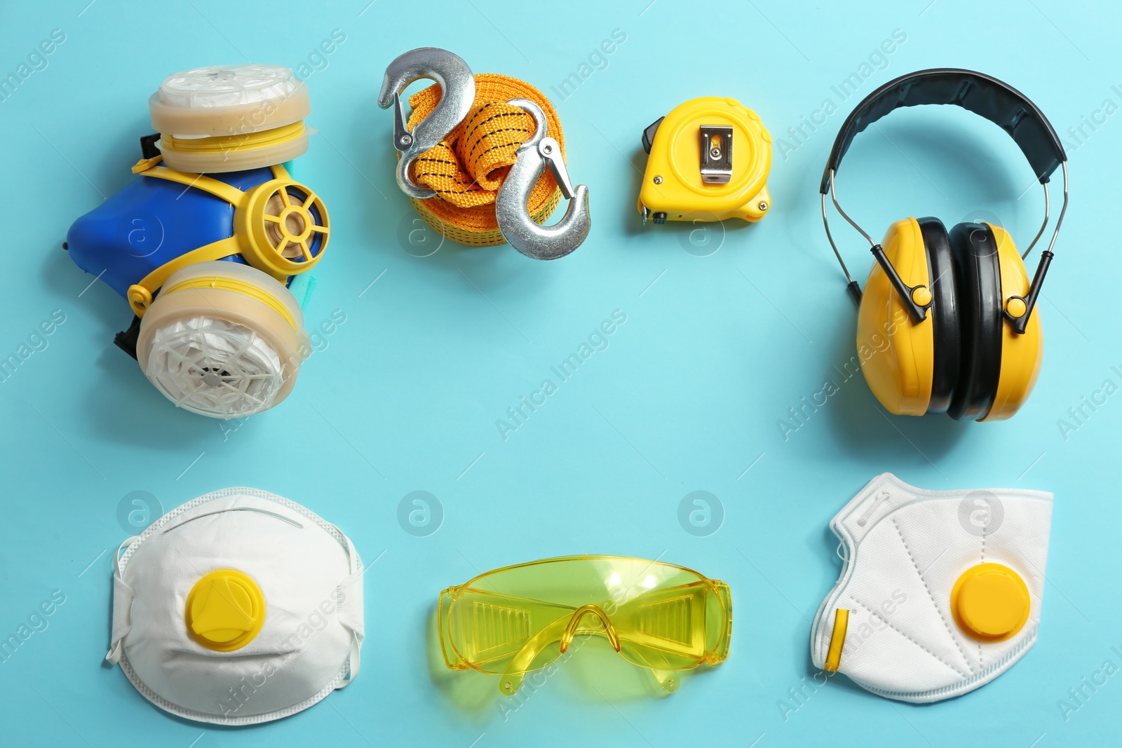 Photo of Flat lay composition with safety equipment and space for text on color background