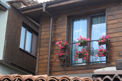 Exterior of beautiful residential buildings with balcony and flowers