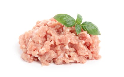 Photo of Pile of raw chicken minced meat  with basil on white background