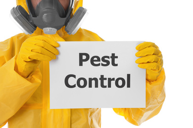 Photo of Man wearing protective suit holding sign PEST CONTROL on white background, closeup