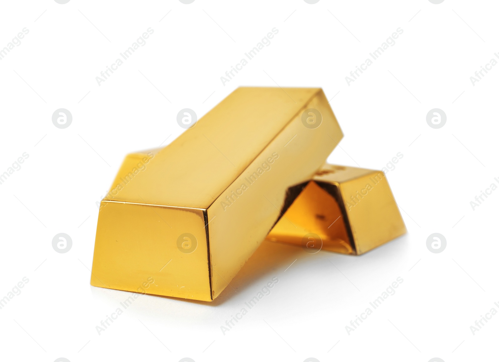 Photo of Precious shiny gold bars on white background