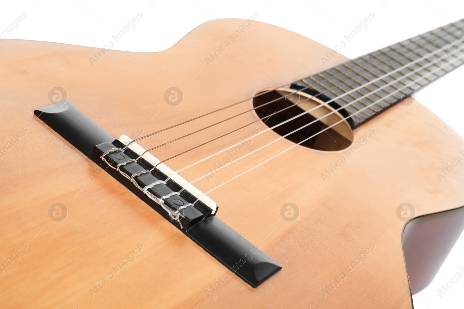 Photo of Acoustic guitar on white background, closeup. Musical instrument