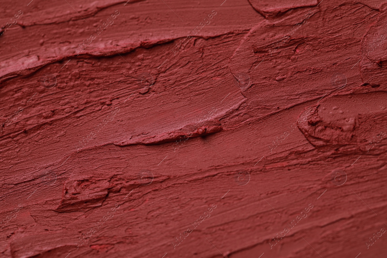 Photo of Texture of bright lipstick as background, closeup