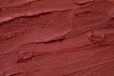 Texture of bright lipstick as background, closeup