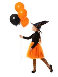 Photo of Cute little girl with balloons wearing Halloween costume on white background