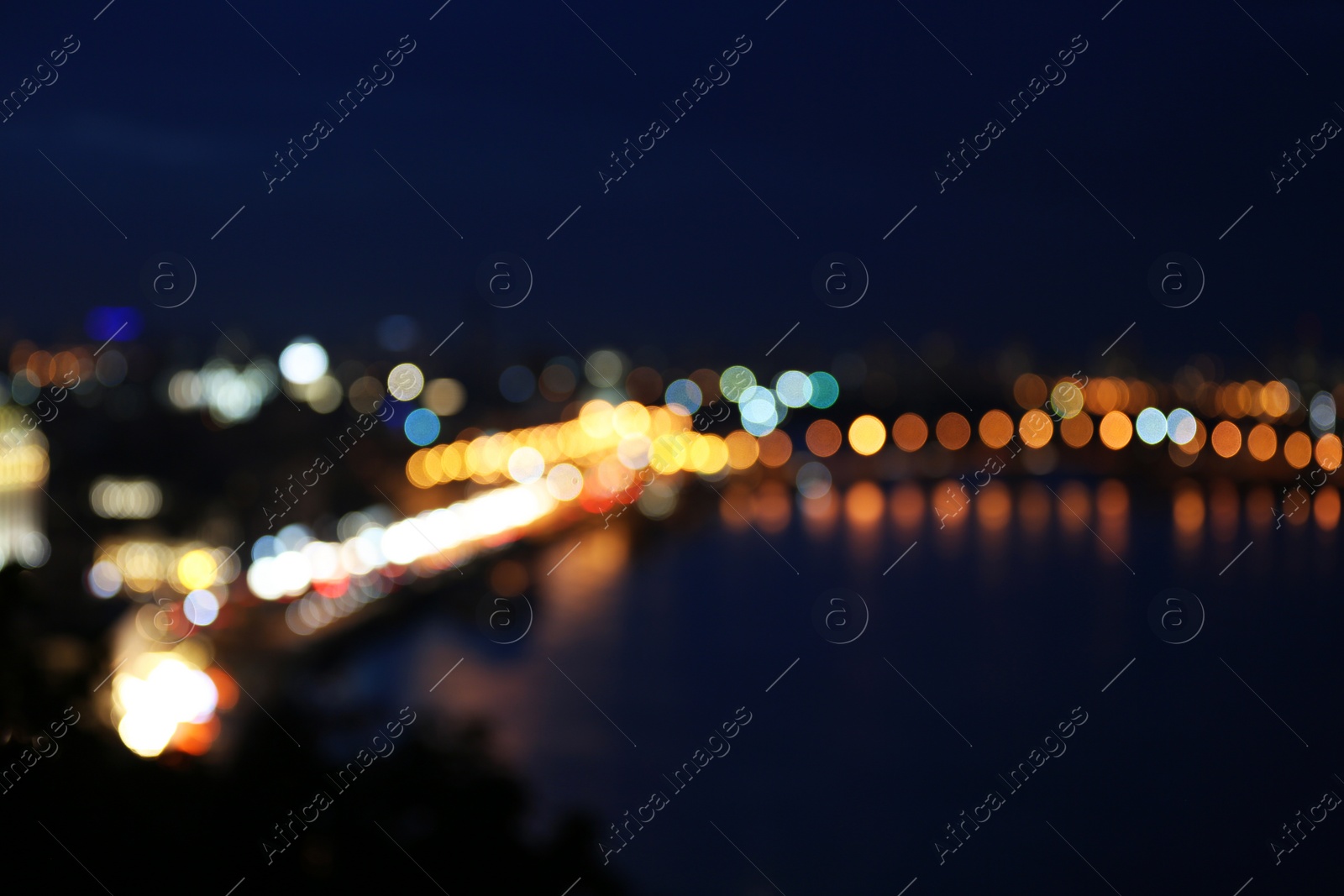 Photo of Blurred view of beautiful city at night. Bokeh effect